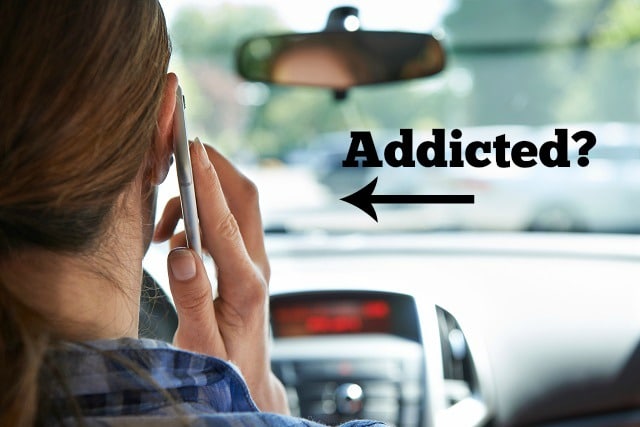 Woman In Car Talking On Mobile Phone Whilst Driving with text that says Addicted