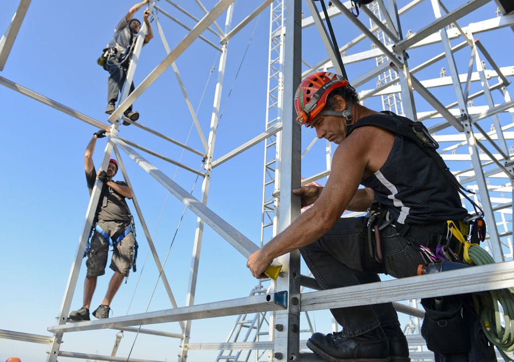 Men work on California PG&E power lines
