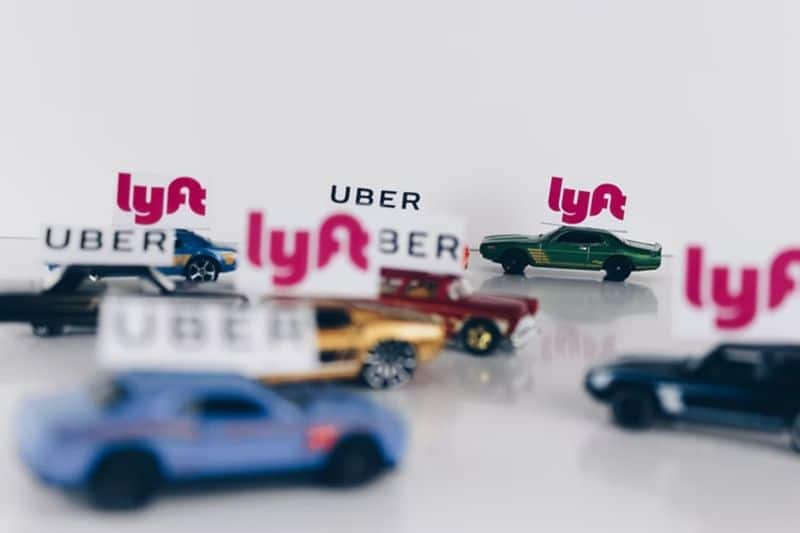 toy cars with lyft and uber signs