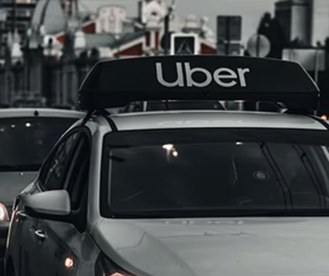 car with uber sign