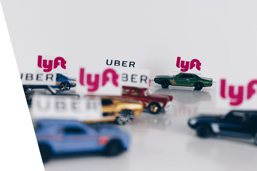 Toy cars with Lyft and Uber signs