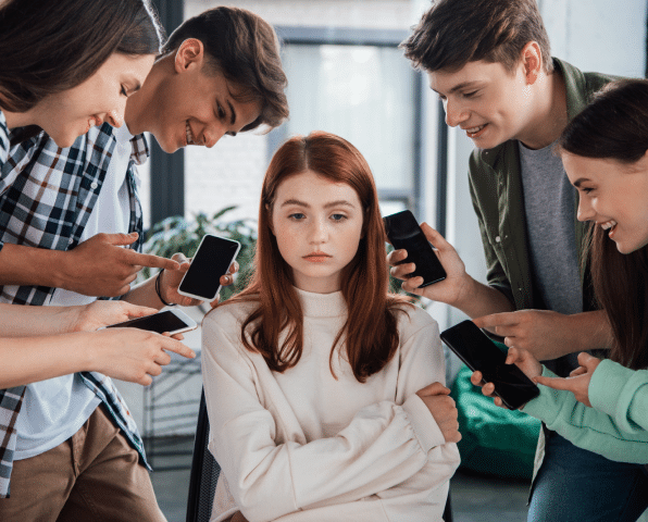 A group of teens cyberbullying their friend on social media