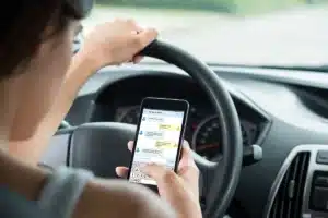 Woman on phone texting and driving