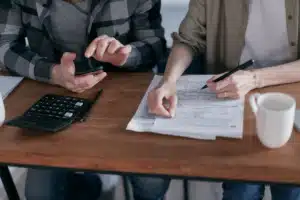 Two people reviewing paperwork