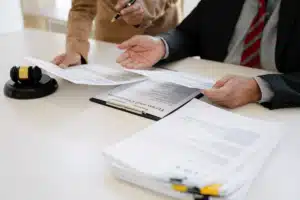 Two people reviewing paperwork