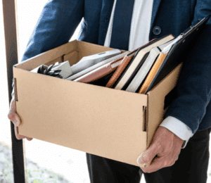 Man carrying office supplies in a box
