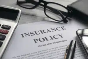 Insurance policy paperwork on a desk