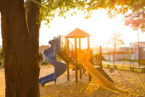 a school playground with sunrise in the background