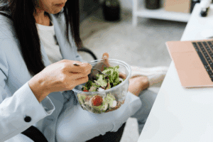 Work lunch break - woman eating salad