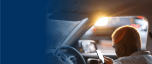 RIdeshare driver looking at phone