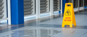 Wideshot of a wet floor sign situated on the floor